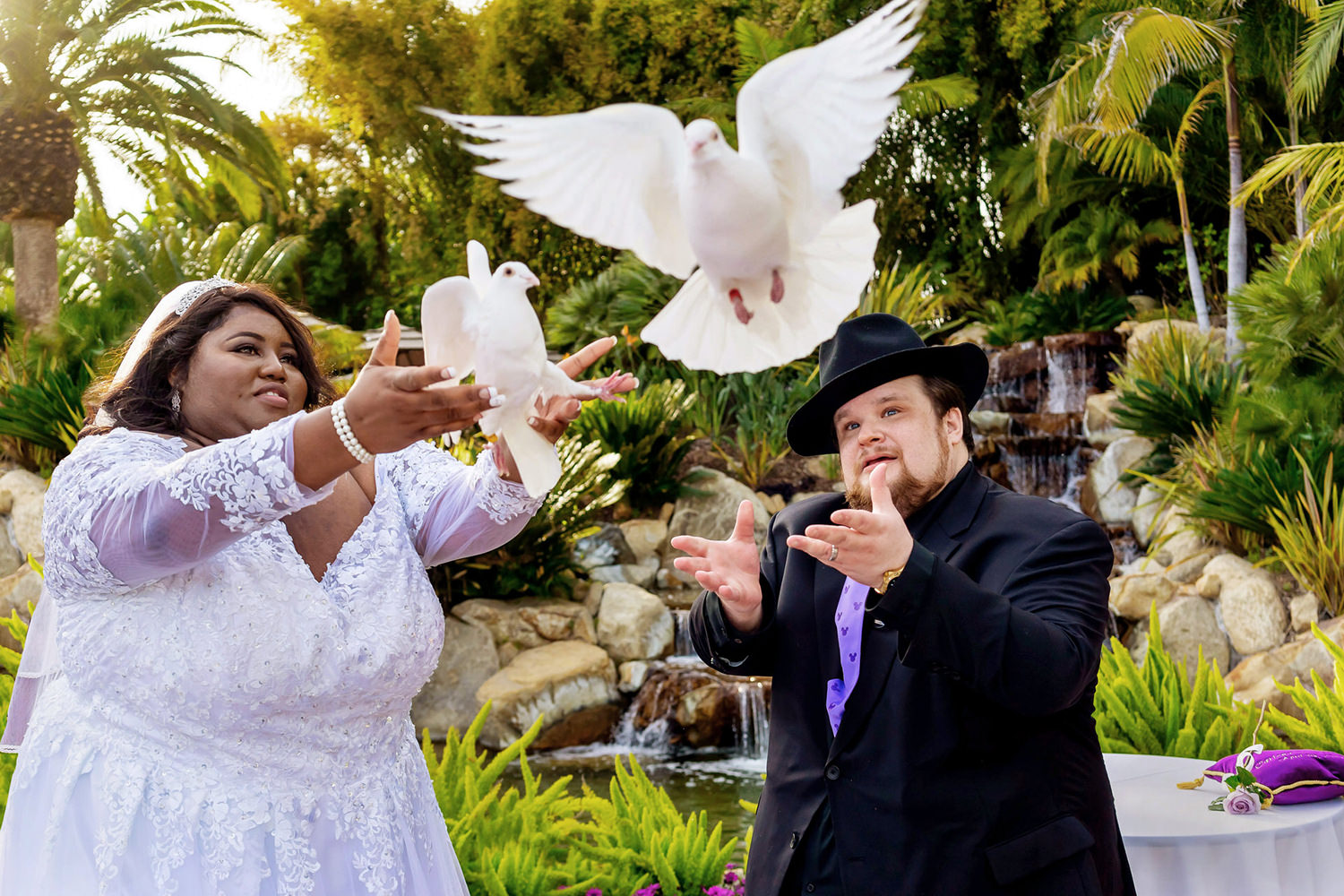 The bride and groom let the doves fly during their wedding ceremony.